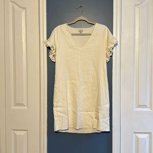 White dress with ruffles on the arms